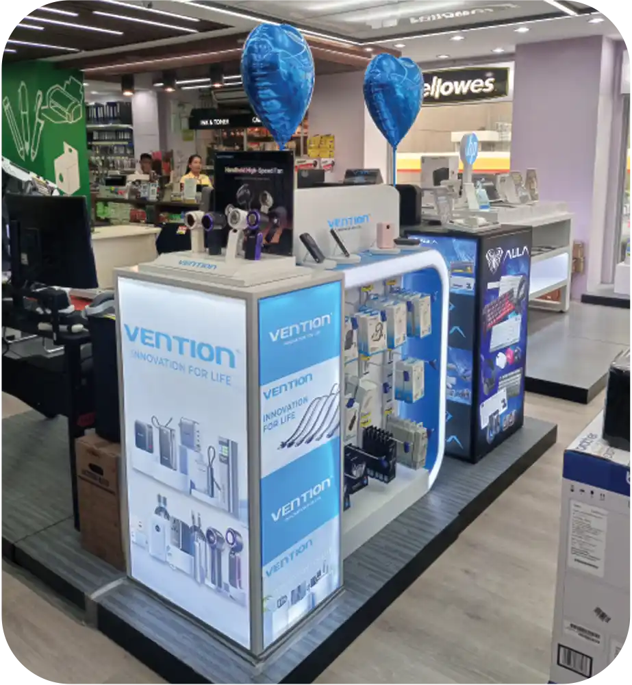 Vention branded retail display showcasing electronic accessories and charging products inside a modern electronics store.